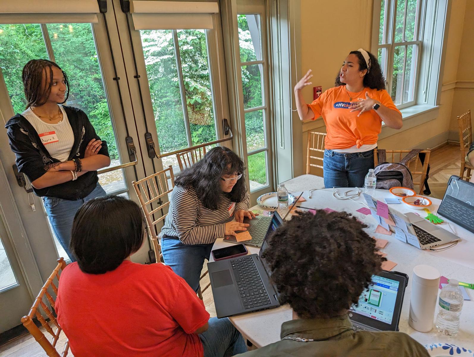 Developing the team solution involves some passionate discussion - HV Digital Rally Hackathon 2024