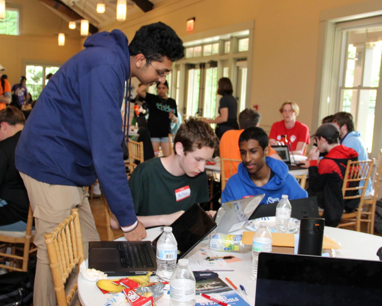 Teams collaborate on researching and developing their solution - Hudson Valley Digital Rally Hackathon 2024